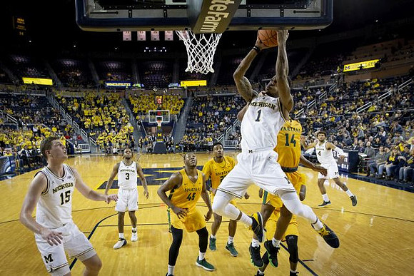 Jon Teske (15), Zavier Simpson (3), Charles Matthews (1), and Isaiah Livers (4)