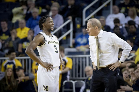 Zavier Simpson (3) and John Beilein