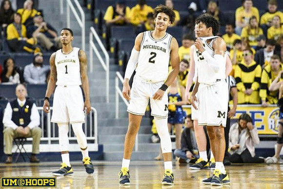 Charles Matthews (1), Jordan Poole (2), and Eli Brooks (55)