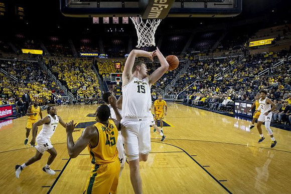 Zavier Simpson (3), Jon Teske (15), and Jordan Poole (2)