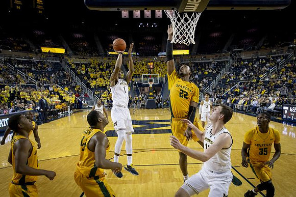 Zavier Simpson (3), Charles Matthews (1), Jon Teske (15), and Jordan Poole (2)