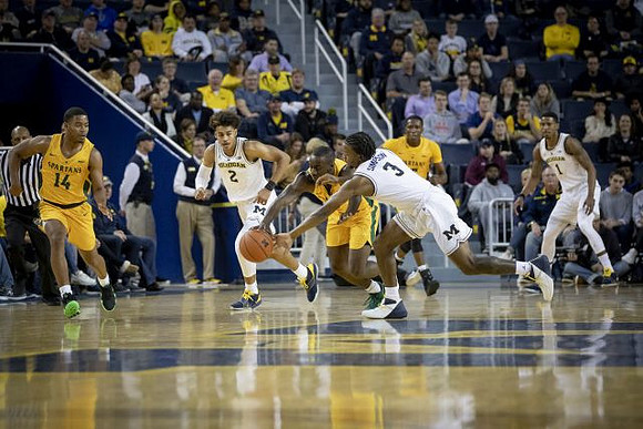Jordan Poole (2), Zavier Simpson (3), and Charles Matthews (1)