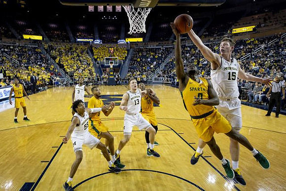 Jon Teske (15), Eli Brooks (55), Zavier Simpson (3), and Zavier Simpson (3)