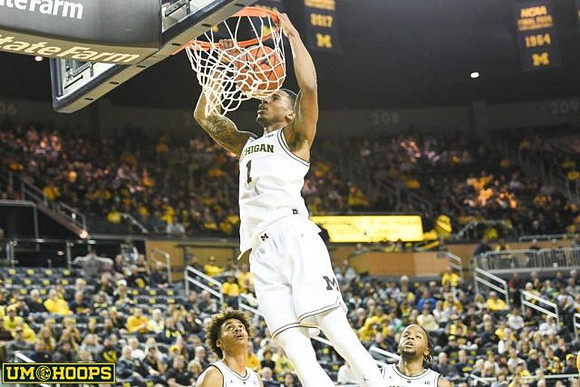Charles Matthews (1), Jordan Poole (2), and Zavier Simpson (3)