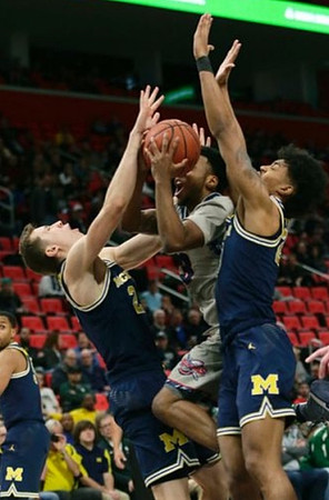 Zavier Simpson (3), Duncan Robinson (22), and Ibi Watson (23)