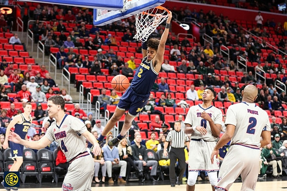 Jordan Poole (2) and Duncan Robinson (22)