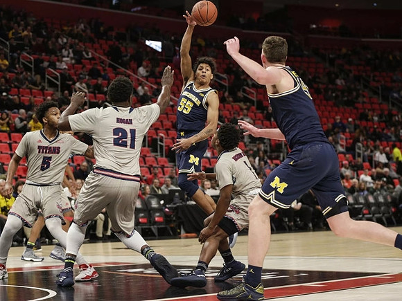 Eli Brooks (55) and Jon Teske (15)
