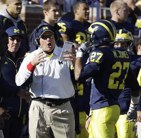 Rich Rodriguez and Mike Jones (27)