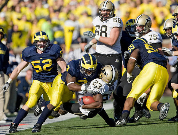 Kevin Leach (52), Stevie Brown (3), and Brandon Graham (55)