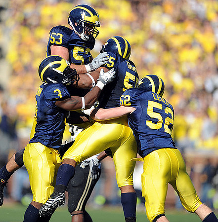 Stevie Brown (3), Ryan Van Bergen (53), Brandon Graham (55), and Kevin Leach (52)