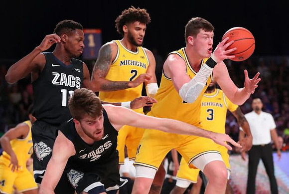 Isaiah Livers (2), Jon Teske (15), and Zavier Simpson (3)