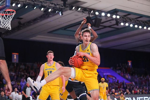 Jon Teske (15), Franz Wagner (21), and Zavier Simpson (3)