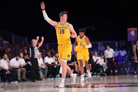 Jon Teske (15) and Isaiah Livers (2)