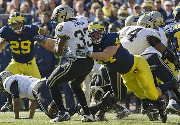 Troy Woolfolk (29) and Mark Moundros (44)