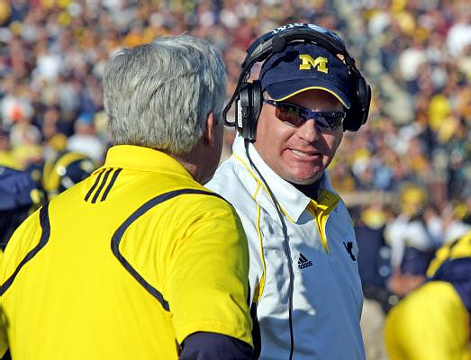 Rich Rodriguez and Greg Robinson