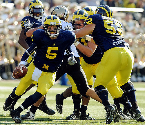 Tate Forcier (5) and Stephen Schilling (52)