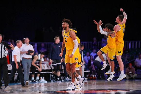 Isaiah Livers (2), Zavier Simpson (3), Eli Brooks (55), and Jon Teske (15)