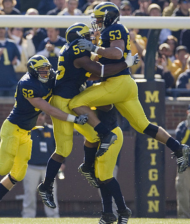 Kevin Leach (52), Brandon Graham (55), and Ryan Van Bergen (53)
