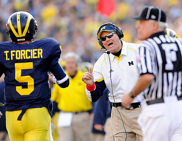 Tate Forcier (5) and Rich Rodriguez