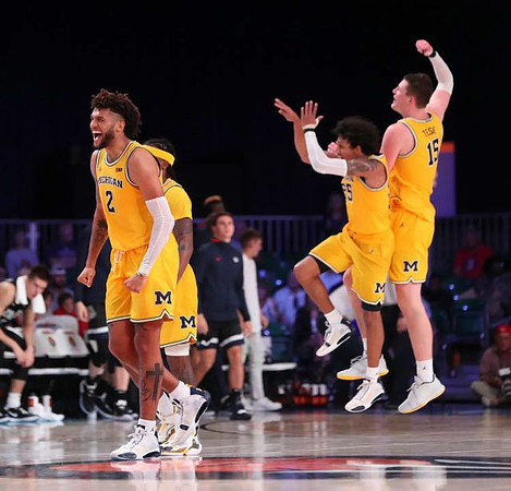 Isaiah Livers (2), Zavier Simpson (3), Eli Brooks (55), and Jon Teske (15)
