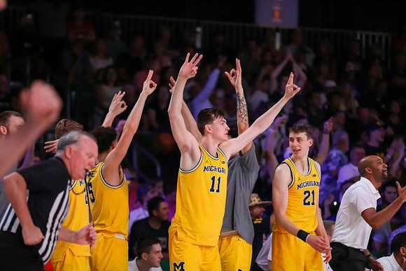 Saddi Washington and Michigan Team