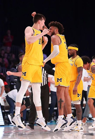 Colin Castleton (11), Isaiah Livers (2), Zavier Simpson (3), and Eli Brooks (55)