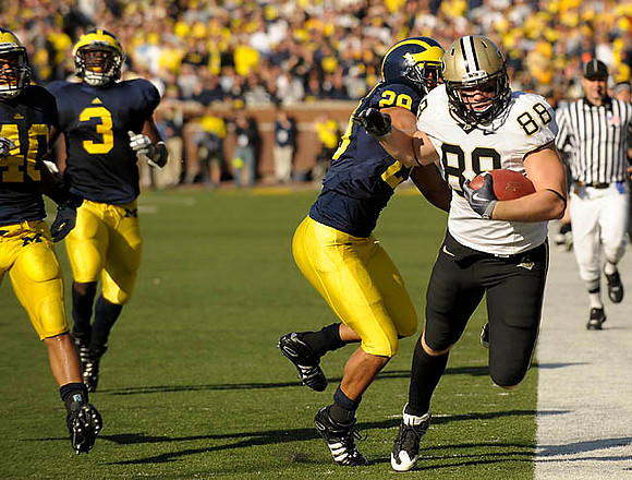 Michael Williams (40), Stevie Brown (3), and Troy Woolfolk (29)
