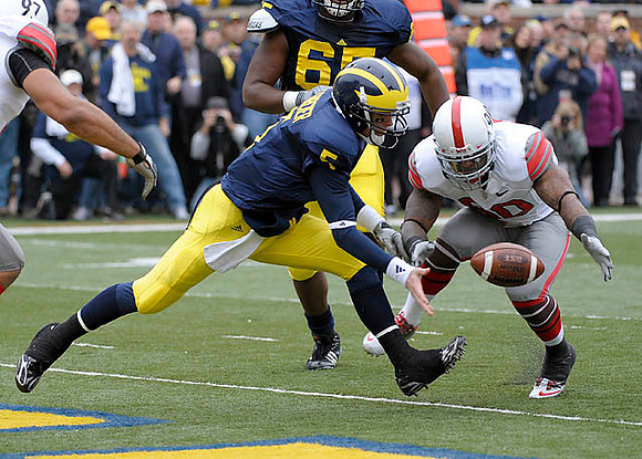 Patrick Omameh (65) and Tate Forcier (5)
