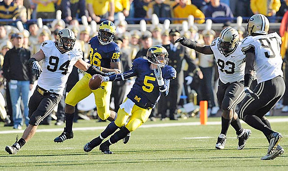 Kevin Koger (86) and Tate Forcier (5)