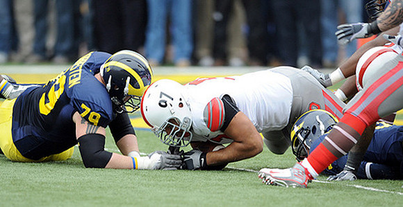 Perry Dorrestein (79) and Tate Forcier (5)