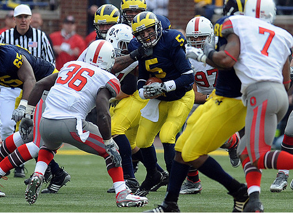 Patrick Omameh (65), Tate Forcier (5), and Martell Webb (80)