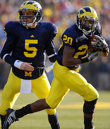 Tate Forcier (5) and Michael Shaw (20)