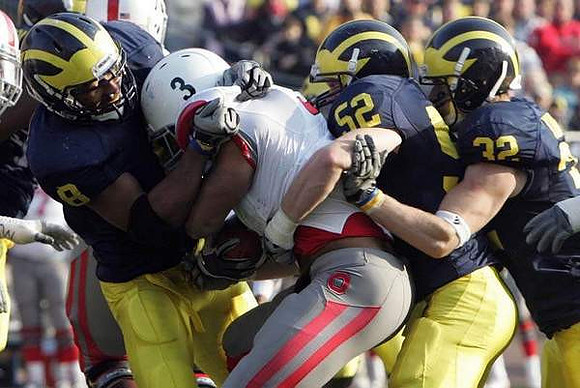 Jonas Mouton (8), Kevin Leach (52), and Jordan Kovacs (32)