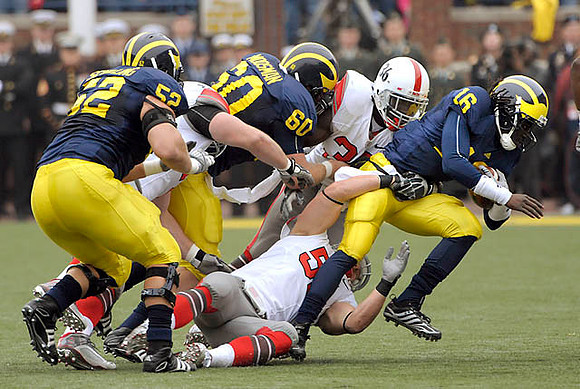 Stephen Schilling (52), David Moosman (60), and Denard Robinson (16)
