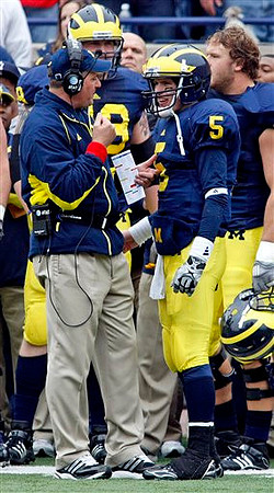 Rich Rodriguez, Craig Roh (88), and Tate Forcier (5)