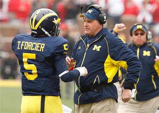 Tate Forcier (5) and Rich Rodriguez