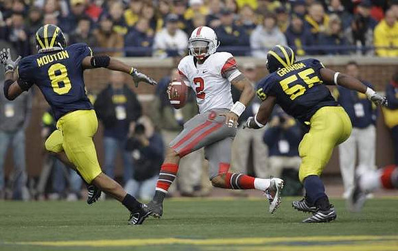 Jonas Mouton (8) and Brandon Graham (55)