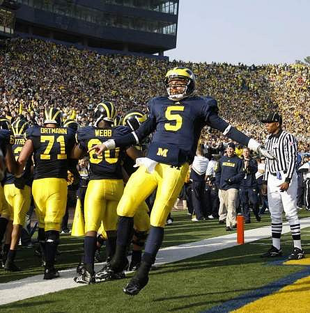 Mark Ortmann (71), Martell Webb (80), and Tate Forcier (5)