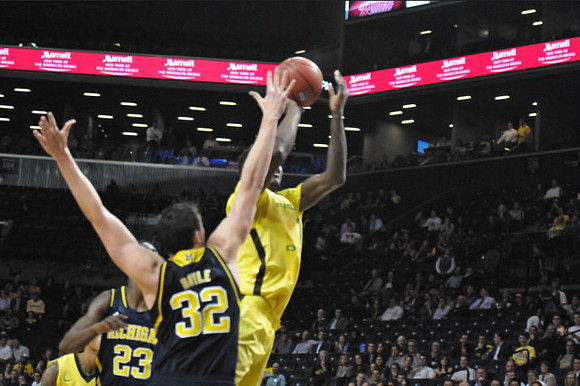 Caris LeVert (23) and Ricky Doyle (32)