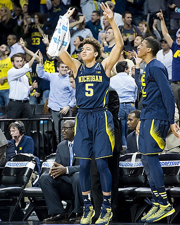 Bacari Alexander, D.J. Wilson (5), and Aubrey Dawkins (24)
