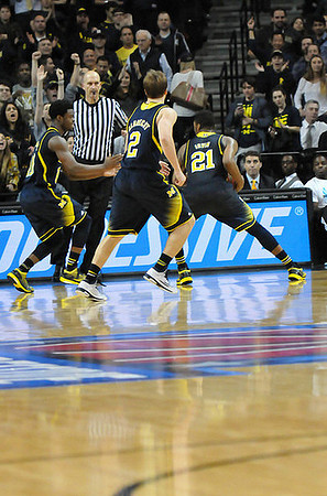 Derrick Walton Jr. (10), Spike Albrecht (2), and Zak Irvin (21)
