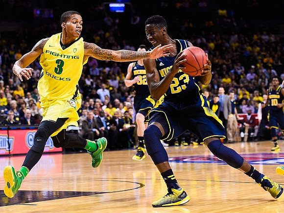 Caris LeVert (23) and Ricky Doyle (32)