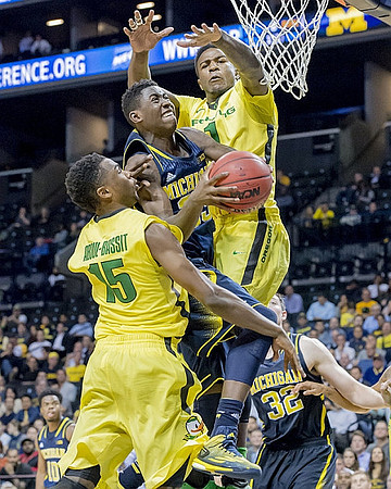 Caris LeVert (23) and Ricky Doyle (32)