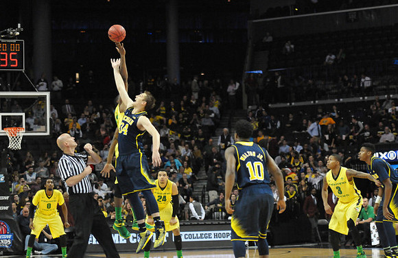 Mark Donnal (34) and Derrick Walton Jr. (10)