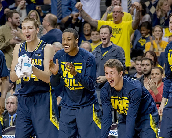 Mark Donnal (34), Muhammad-Ali Abdur-Rahkman (12), and Andrew Dakich (11)
