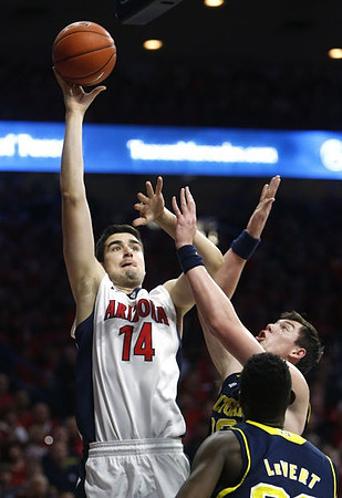 Ricky Doyle (32) and Caris LeVert (23)