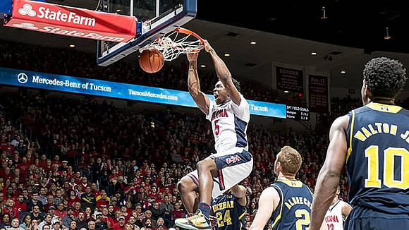 Aubrey Dawkins (24), Spike Albrecht (2), and Derrick Walton Jr. (10)