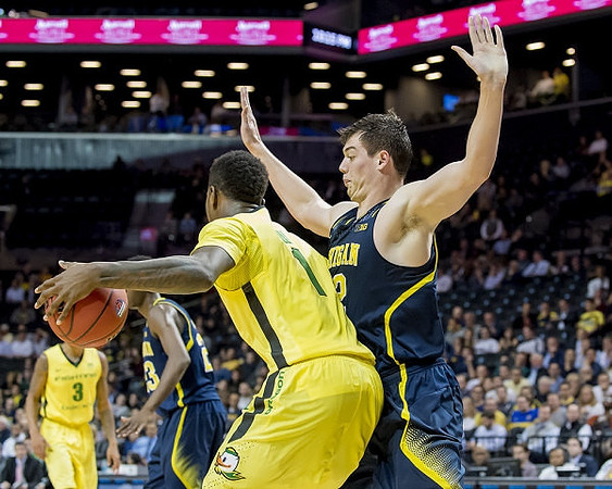 Caris LeVert (23) and Ricky Doyle (32)