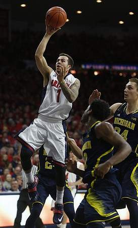 Derrick Walton Jr. (10) and Mark Donnal (34)