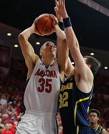 Ricky Doyle (32) and Derrick Walton Jr. (10)